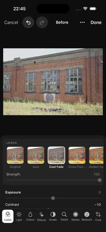 Numa on iPhone: a brick building with the Looks strip underneath, Cool Fade chosen, and its Strength slider.